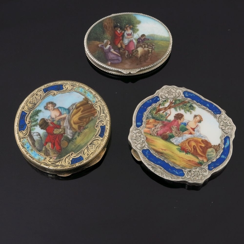 35 - Two Continental silver gilt powder compacts, each with printed enamelled covers depicting courtly co... 