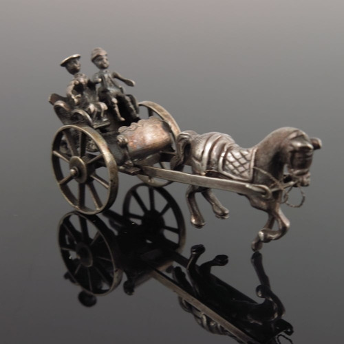 37 - A Continental white metal miniature of a couple in a horse-drawn carriage, together with a miniature... 