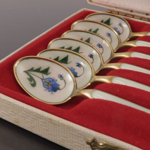 41 - A cased set of six Norwegian silver gilt and cream enamel coffee spoons, Aksel Holmsen, Sandefjord c... 