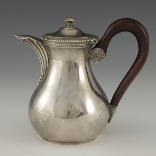 48 - A French silver teapot or water jug, EC, Paris circa 1830, baluster form with reeded spout, lid and ... 