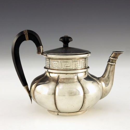 49 - A Dutch silver teapot, J M van Kempen and Sons, Voorschoten 1863, bulbous lobed melon form with etch... 