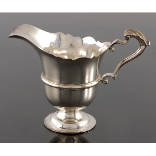 57 - An Elizabeth II Irish silver jug, Royal Irish Silver Ltd., Dublin 1967, banded rounded helmet form w... 