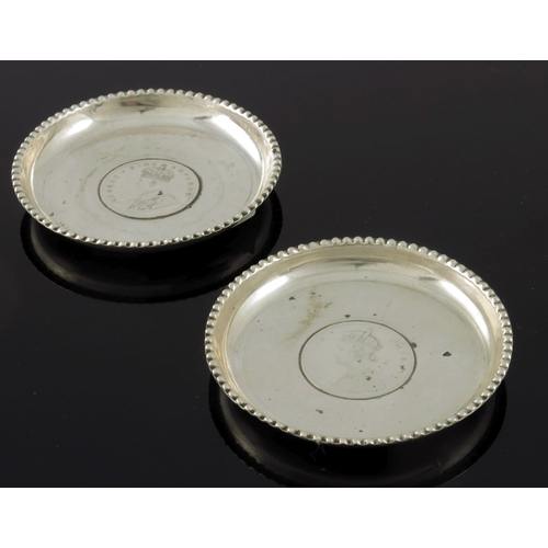 6 - A pair of Anglo Indian silver coin set dishes, dated 1878 and 1917, each with a one Rupee coin, Vict... 