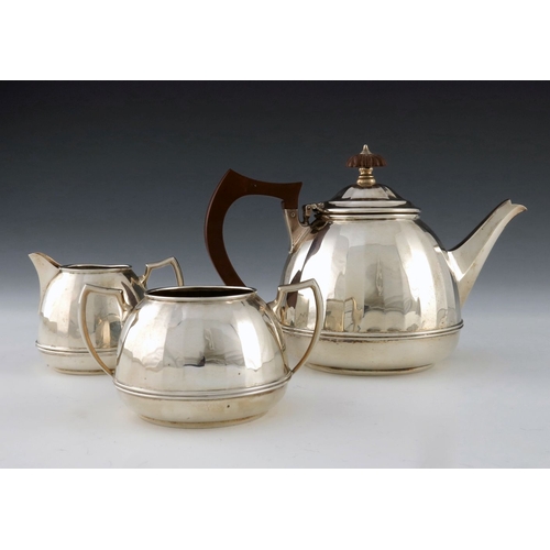 65 - A George VI silver three piece tea set, Barker Brothers Silver, Birmingham 1936, domed and faceted, ... 