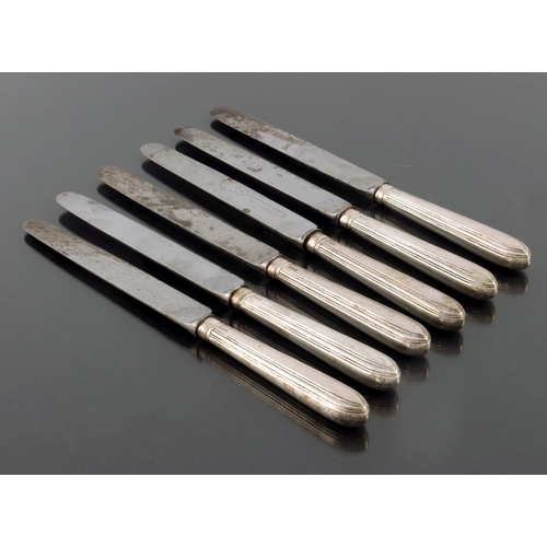 67 - A set of six George III silver dinner knives, IT, London 1791, reeded point form, with steel blades,... 