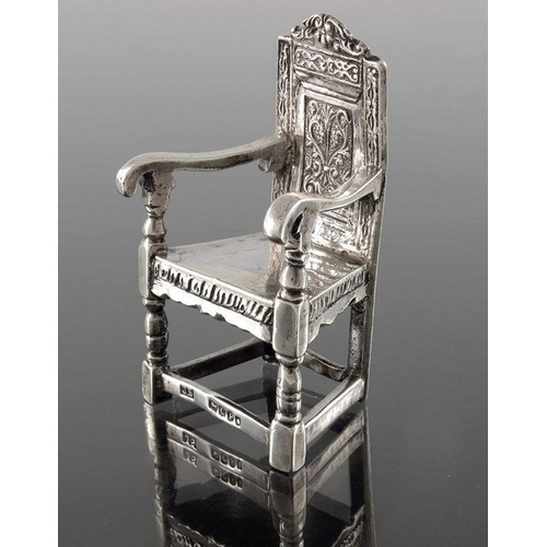 68 - A Victorian silver miniature chair, John Smith, London 1898, modelled as Shakespeare's armchair, Ger... 