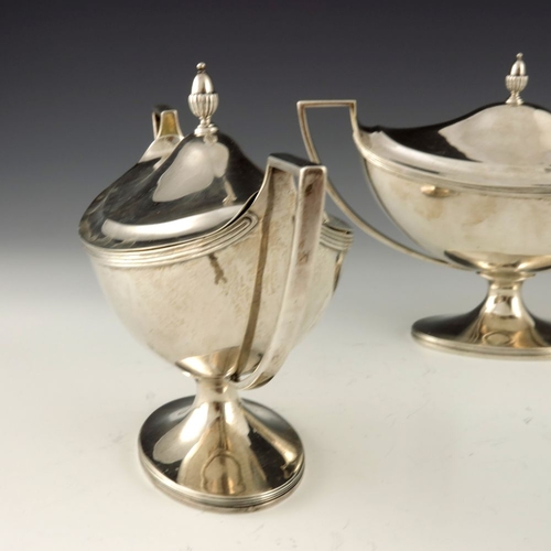 69 - A pair of George III silver sauce tureens and covers, Henry Chawner and John Emes, London 1797, twin... 