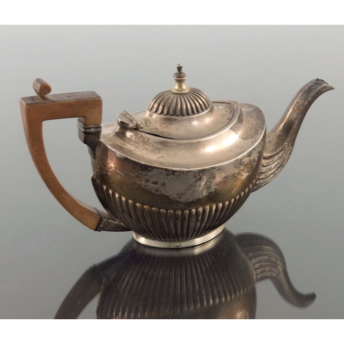 76 - A Victorian silver bachelor's teapot, Joseph Gloster, Birmingham 1901, half reeded boat form with og... 