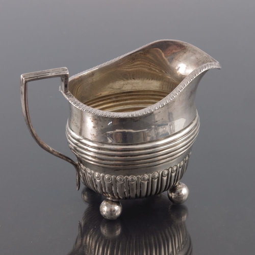 89 - A Victorian silver jug, Mappin and Webb, Sheffield 1887, helmet form with embossed reeded band above... 