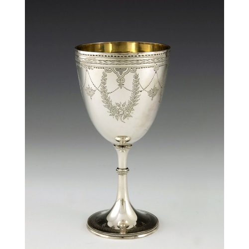 90 - A Victorian silver goblet, Fenton Brothers, London 1877, engraved with foliate and beaded garlands, ... 