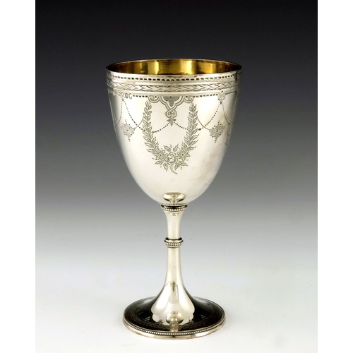 90 - A Victorian silver goblet, Fenton Brothers, London 1877, engraved with foliate and beaded garlands, ... 