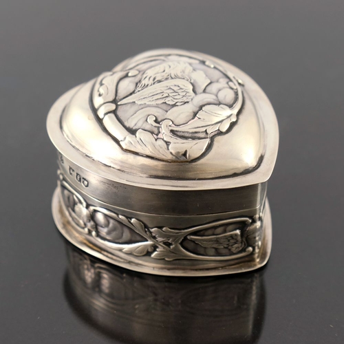 96 - An Edwardian silver box, William Comyns, London 1901, heart shaped and embossed with Reynolds Angels... 