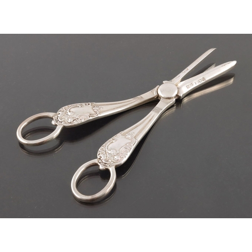 102 - A pair of Edwardian silver grape scissors, Mappin and Webb, London 1903, Rococo scroll design, 17cm ... 