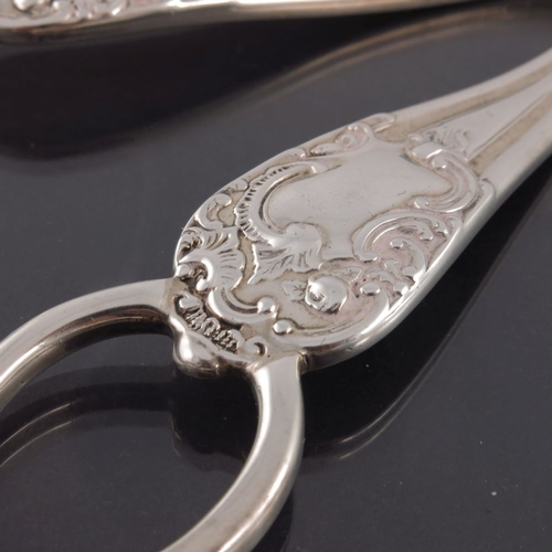 102 - A pair of Edwardian silver grape scissors, Mappin and Webb, London 1903, Rococo scroll design, 17cm ... 