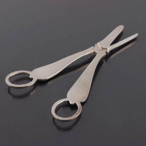 102 - A pair of Edwardian silver grape scissors, Mappin and Webb, London 1903, Rococo scroll design, 17cm ... 