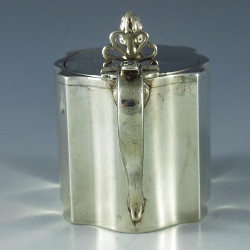 103 - Charles Perry and Co., Chester 1930, a George V silver mustard pot, straight sided ogee fluted recta... 