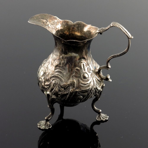 110 - An early George III silver cream jug, Samuel Meriton, London 1762, ogee baluster form with fret rim,... 