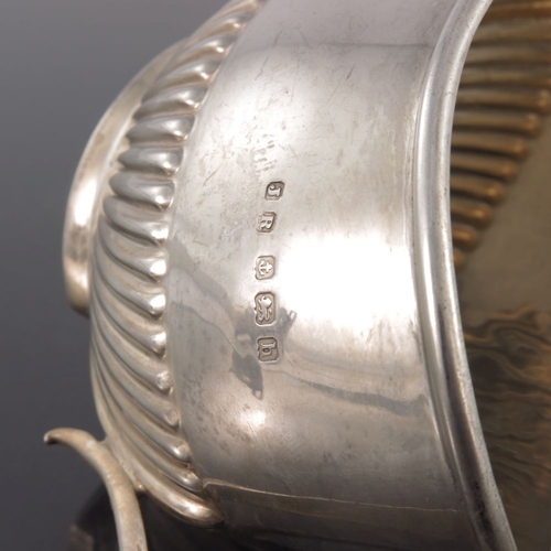 114 - An Edwardian silver jug, John Rose, Birmingham 1907, half reeded boat form with angular handle, 12.5... 