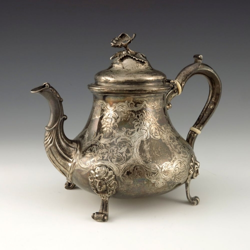 116 - A Victorian silver teapot, Edward Pairpoint and George Wood, London 1856, baluster form, chased with... 