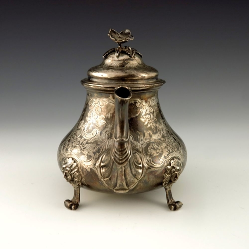 116 - A Victorian silver teapot, Edward Pairpoint and George Wood, London 1856, baluster form, chased with... 