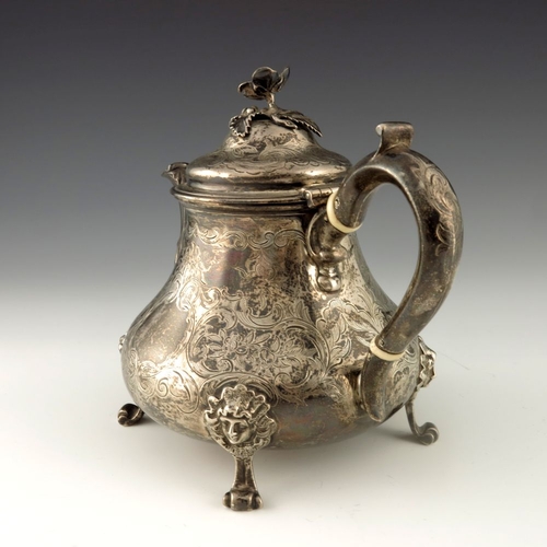 116 - A Victorian silver teapot, Edward Pairpoint and George Wood, London 1856, baluster form, chased with... 