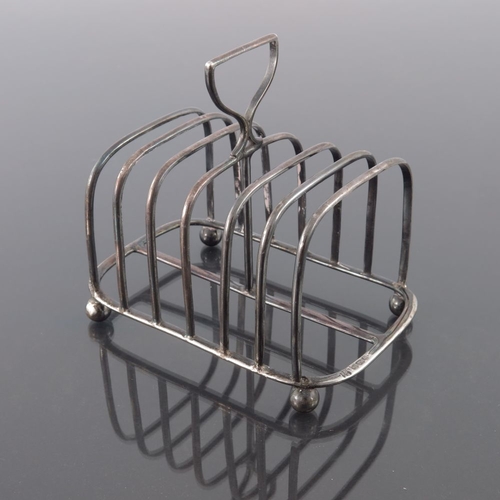 119 - A Victorian silver six division toast rack, James Dixon and Sons, Sheffield 1895, plain wire constru... 