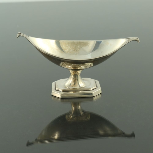 123 - A Victorian silver salt cellar, Thomas Bradbury and Sons, London 1895, pedestal twin handled boat fo... 