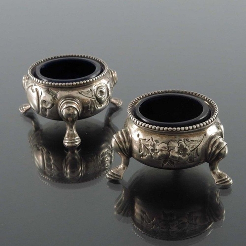 125 - A pair of Victorian silver salt cellars, Beare Falcke, London 1866, cauldron form, embossed with flo... 