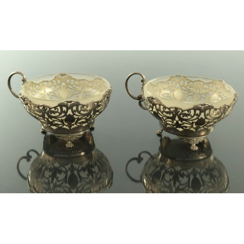 129 - A pair of George VI silver bowls, Gladwin Ltd, Sheffield 1941, pierced decoration and scroll handle ... 