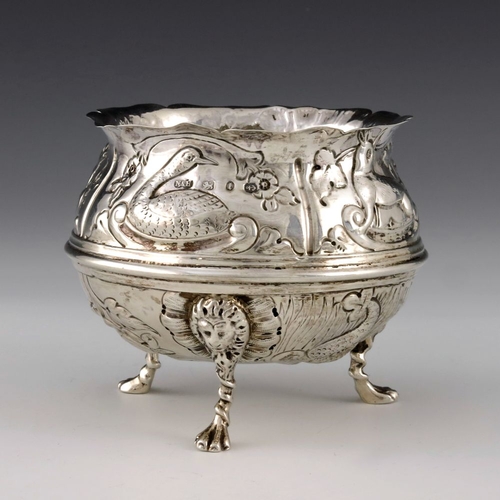 136 - A Victorian silver bowl, Nathan and Hayes, Birmingham 1893, cauldron form, embossed in relief with v... 