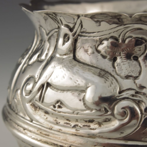 136 - A Victorian silver bowl, Nathan and Hayes, Birmingham 1893, cauldron form, embossed in relief with v... 