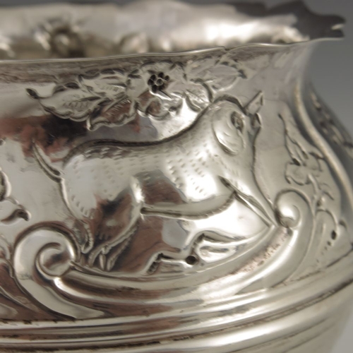 136 - A Victorian silver bowl, Nathan and Hayes, Birmingham 1893, cauldron form, embossed in relief with v... 