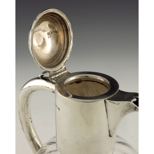 151 - An Edwardian silver mounted glass claret jug, Alexander Clark Manufacturing Co., Birmingham 1909, th... 