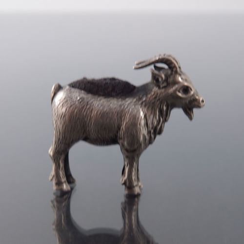 160 - An Edwardian novelty silver pin cushion, Adie and Lovekin, Chester 1909, modelled as a goat, 3cm hig... 