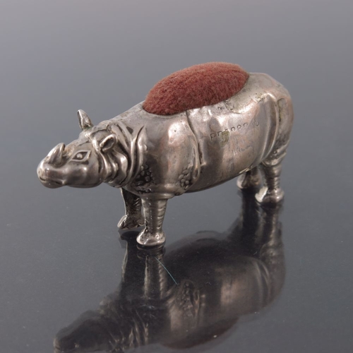 162 - An Edwardian novelty silver pin cushion, Birmingham 1908, modelled as a rhinoceros, 5cm long