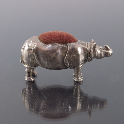 162 - An Edwardian novelty silver pin cushion, Birmingham 1908, modelled as a rhinoceros, 5cm long