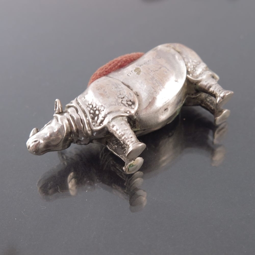 162 - An Edwardian novelty silver pin cushion, Birmingham 1908, modelled as a rhinoceros, 5cm long