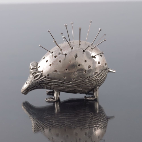 164 - An Edwardian novelty silver pin cushion, George Loveridge and Co., Birmingham 1904, modelled as a po... 