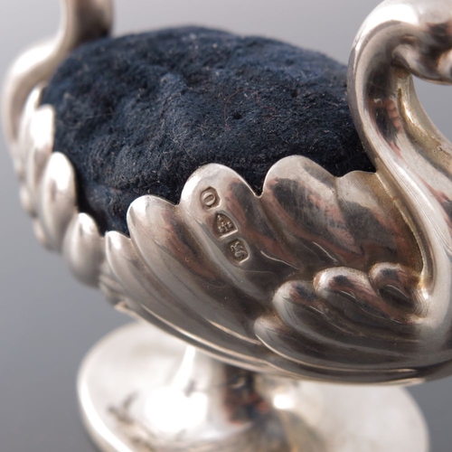 169 - A Victorian novelty silver pin cushion, Hilliard and Thomason, Chester 1897, modelled as two swans, ... 