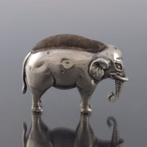 172 - An Edwardian novelty silver pin cushion, Adie and Lovekin, Birmingham 1907, modelled as an elephant ... 