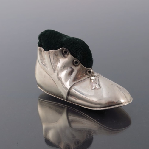 176 - An Edwardian novelty silver pin cushion, Levi and Salaman, Birmingham 1909, modelled as a boot or sh... 