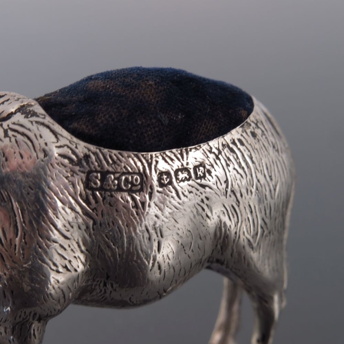 185 - An Edwardian novelty silver pin cushion, Sydney and Co., Birmingham 1909, modelled as a donkey, stan... 