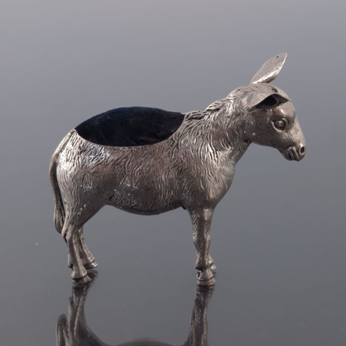 185 - An Edwardian novelty silver pin cushion, Sydney and Co., Birmingham 1909, modelled as a donkey, stan... 