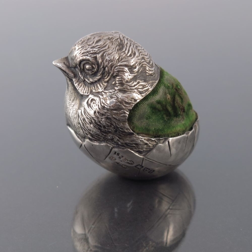 186 - An Edwardian novelty silver pin cushion, Sampson Mordan, Chester 1905, modelled as a chick emerging ... 