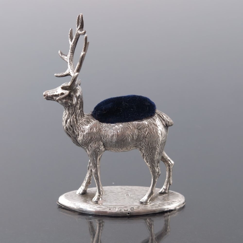 187 - A George V novelty silver pin cushion, Adie and Lovekin, Birmingham 1912, modelled as a stag, on ova... 