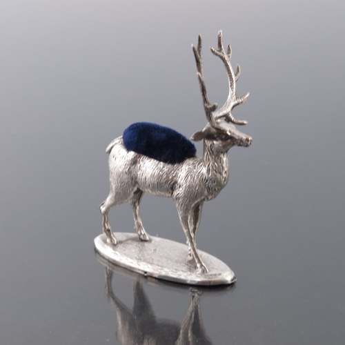 187 - A George V novelty silver pin cushion, Adie and Lovekin, Birmingham 1912, modelled as a stag, on ova... 