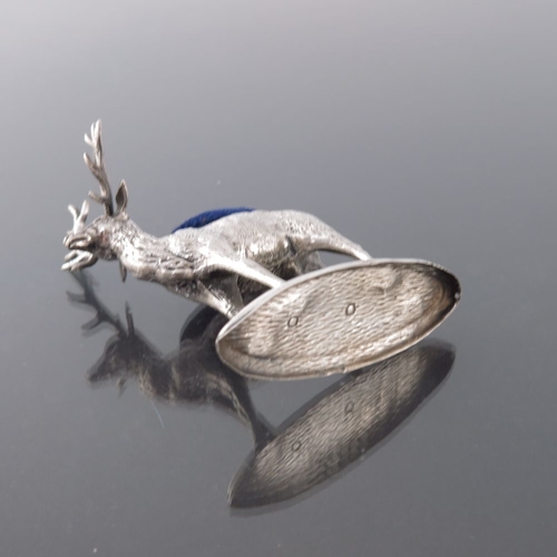 187 - A George V novelty silver pin cushion, Adie and Lovekin, Birmingham 1912, modelled as a stag, on ova... 