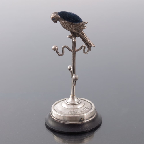 195 - An Edwardian novelty silver ring tree pin cushion, Sydney and Co., Birmingham 1909, modelled as a pa... 