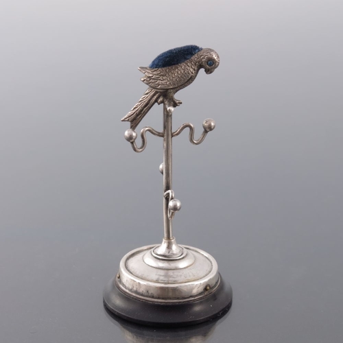 195 - An Edwardian novelty silver ring tree pin cushion, Sydney and Co., Birmingham 1909, modelled as a pa... 