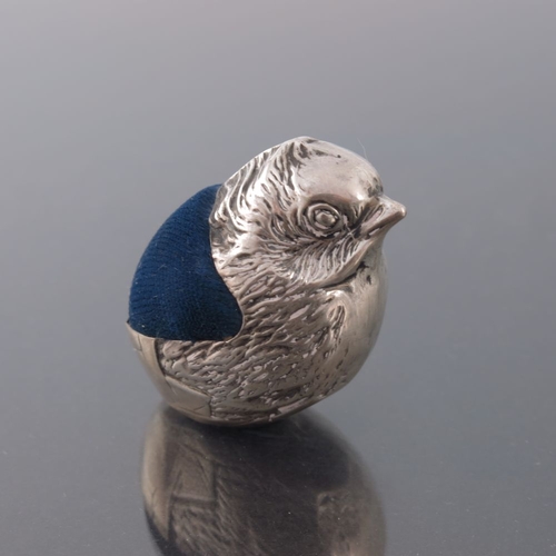 197 - An Edwardian novelty silver pin cushion, Sampson Mordan, Chester 1908, modelled as a chick emerging ... 